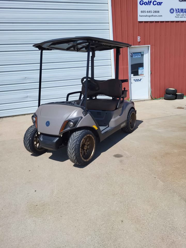 2025 Yamaha Drive2 PTV gas golf car with QuieTech EFI engine, independent rear suspension, bronze wheels, and sleek gray body, for sale at Northern Hills Golf Cars in Spearfish, SD.