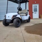 2025 Yamaha Drive2 PTV gas golf car in white with QuieTech EFI engine, independent rear suspension, and tan seats, available at Northern Hills Golf Cars in Spearfish, SD.