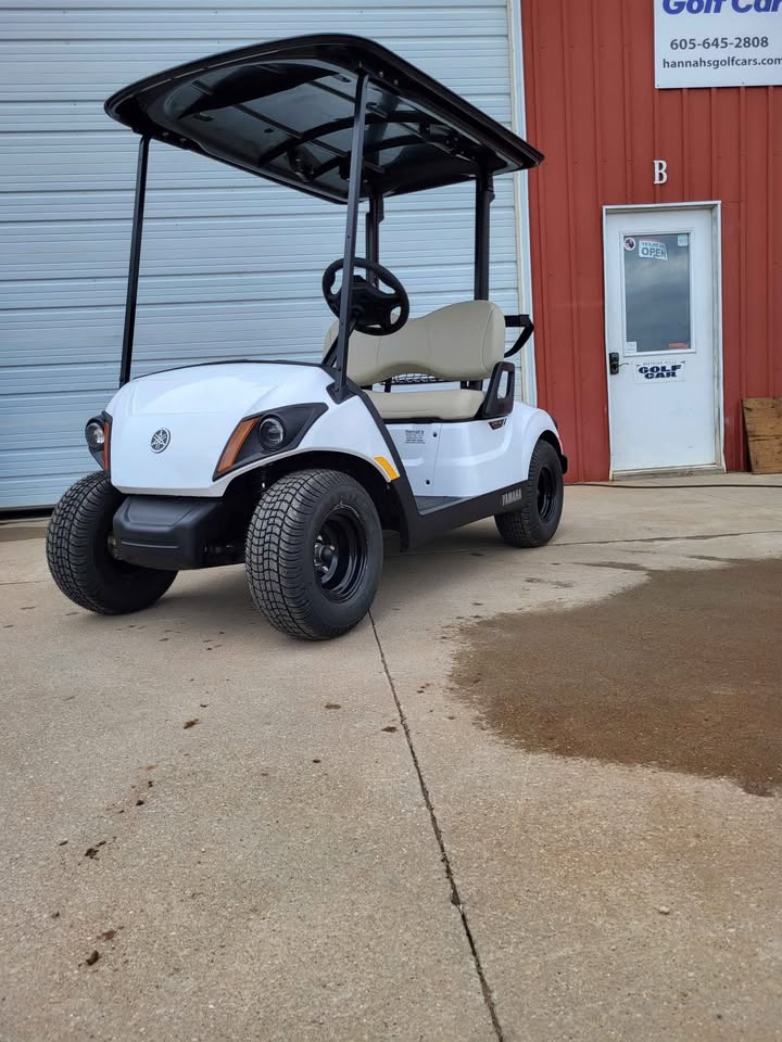 2025 Yamaha Drive2 PTV gas golf car in white with QuieTech EFI engine, independent rear suspension, and tan seats, available at Northern Hills Golf Cars in Spearfish, SD.